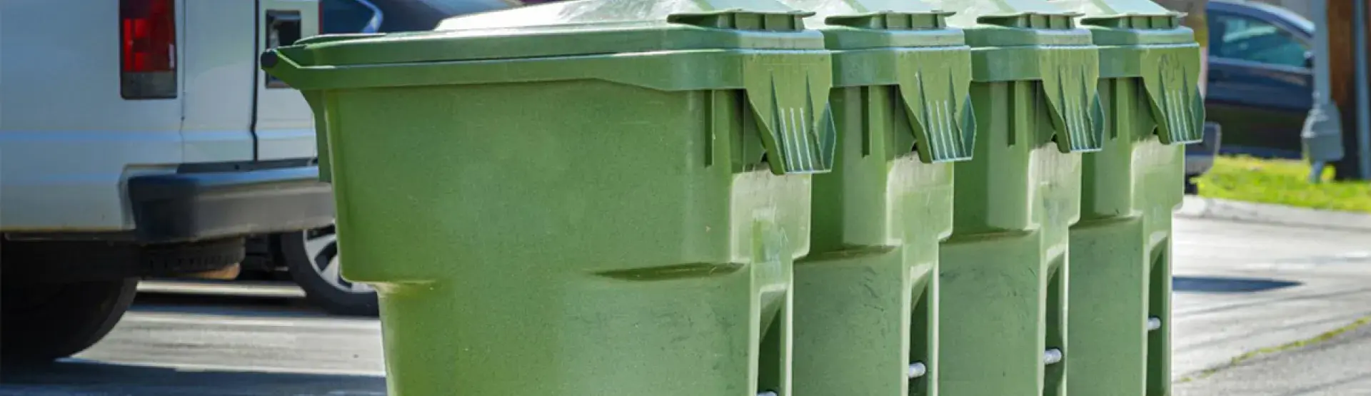 photo of trash cans along street