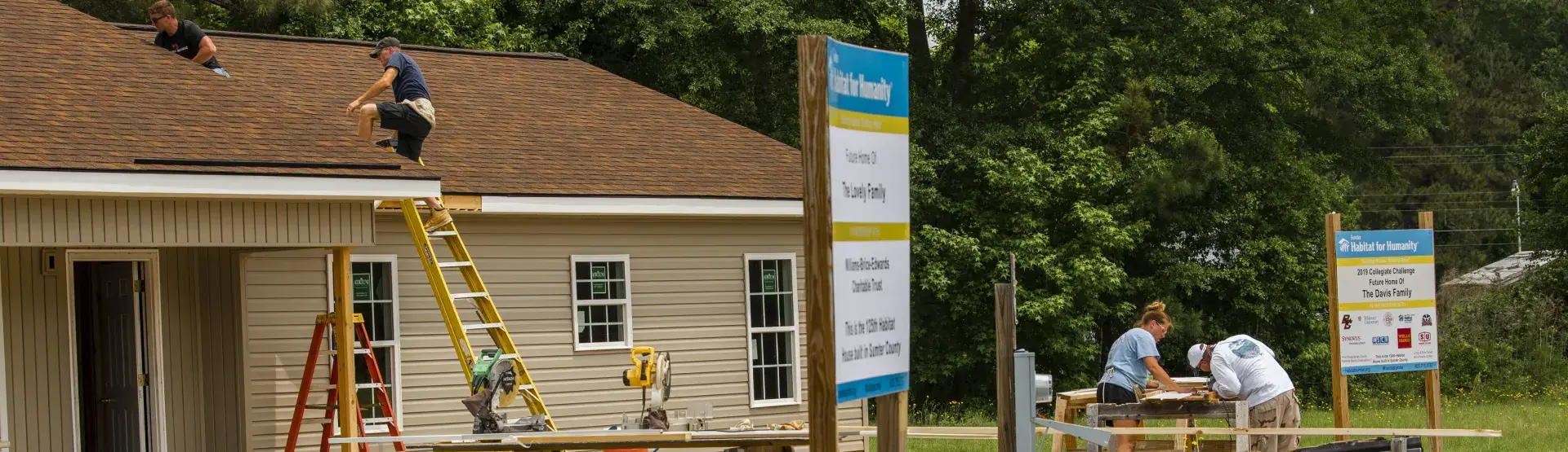 volunteers helping to build a home