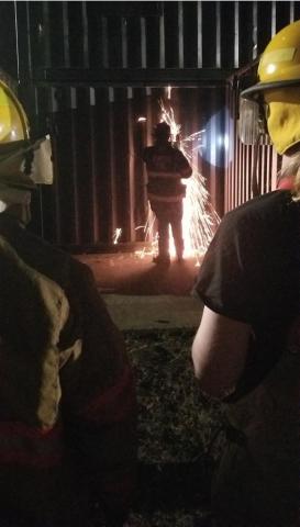 Explorers breaching a steel wall